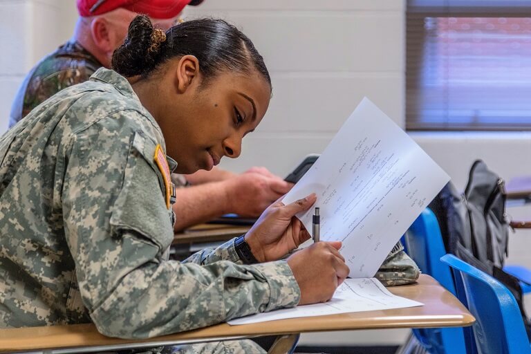Female soldier sitting in classroom
