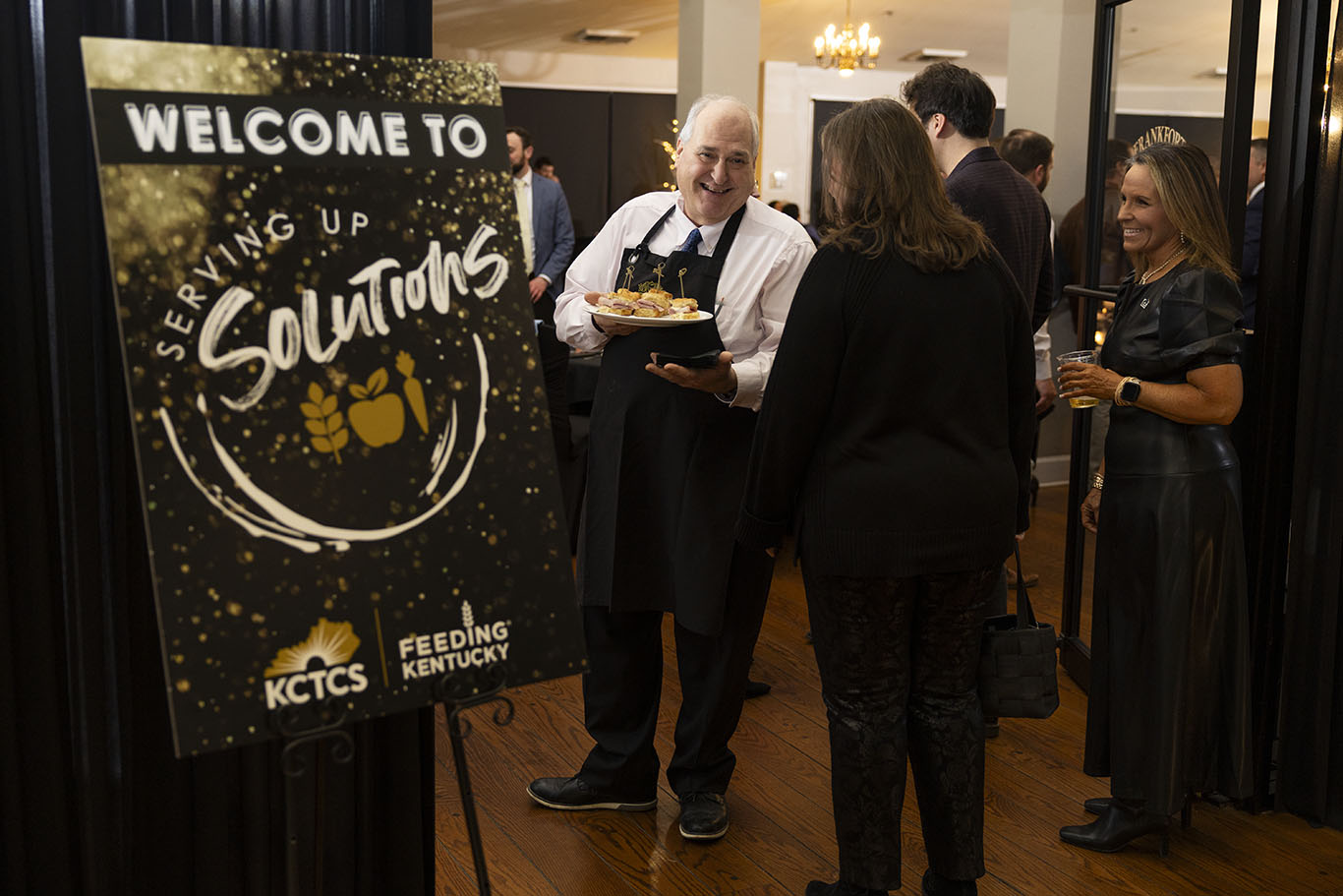 photo of food being served by legislature at Serving Up Solutions 2026