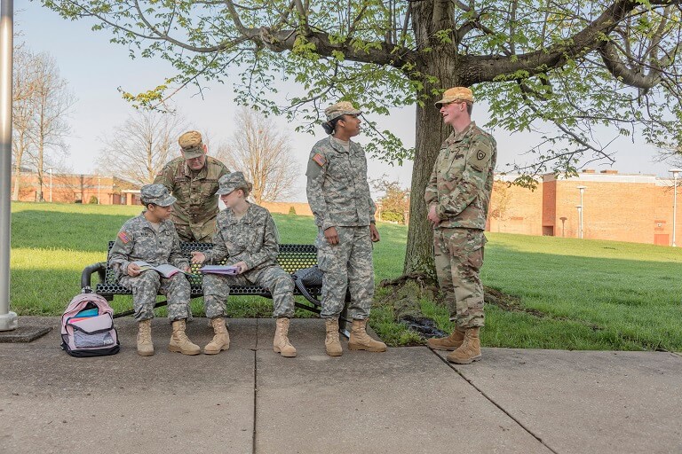 Group of soldiers on college campus.