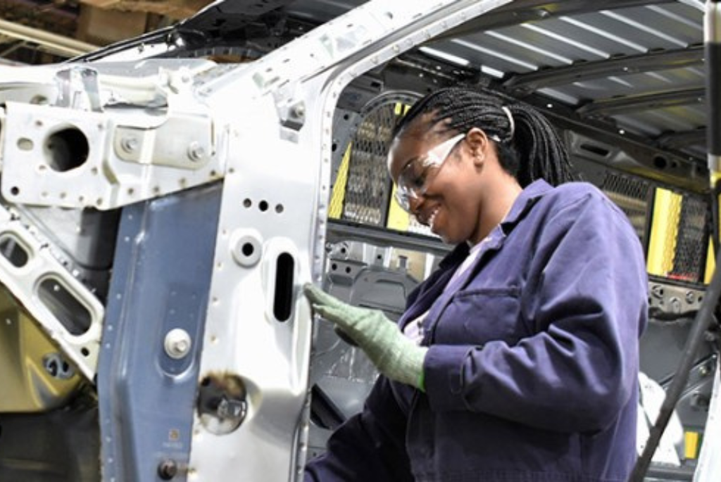 kctcs female student working on the body of a vehicle 