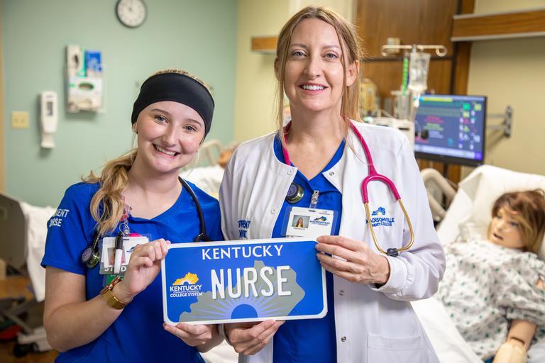 nursing student holding kctcs license plate