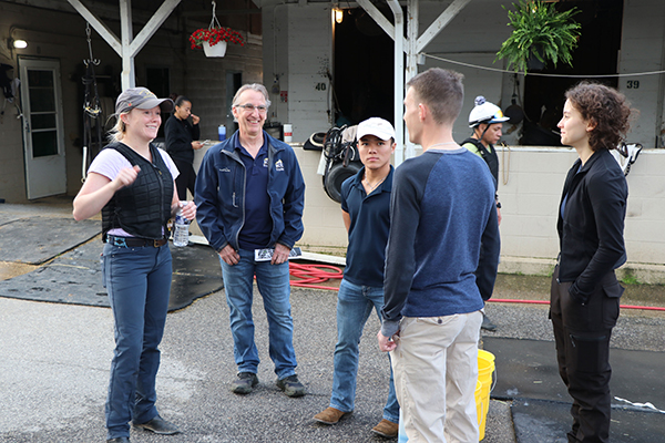 BCTC equine students and Reme Bellocq, workforce liaison, speak with program alum Erica Herrforth (left).