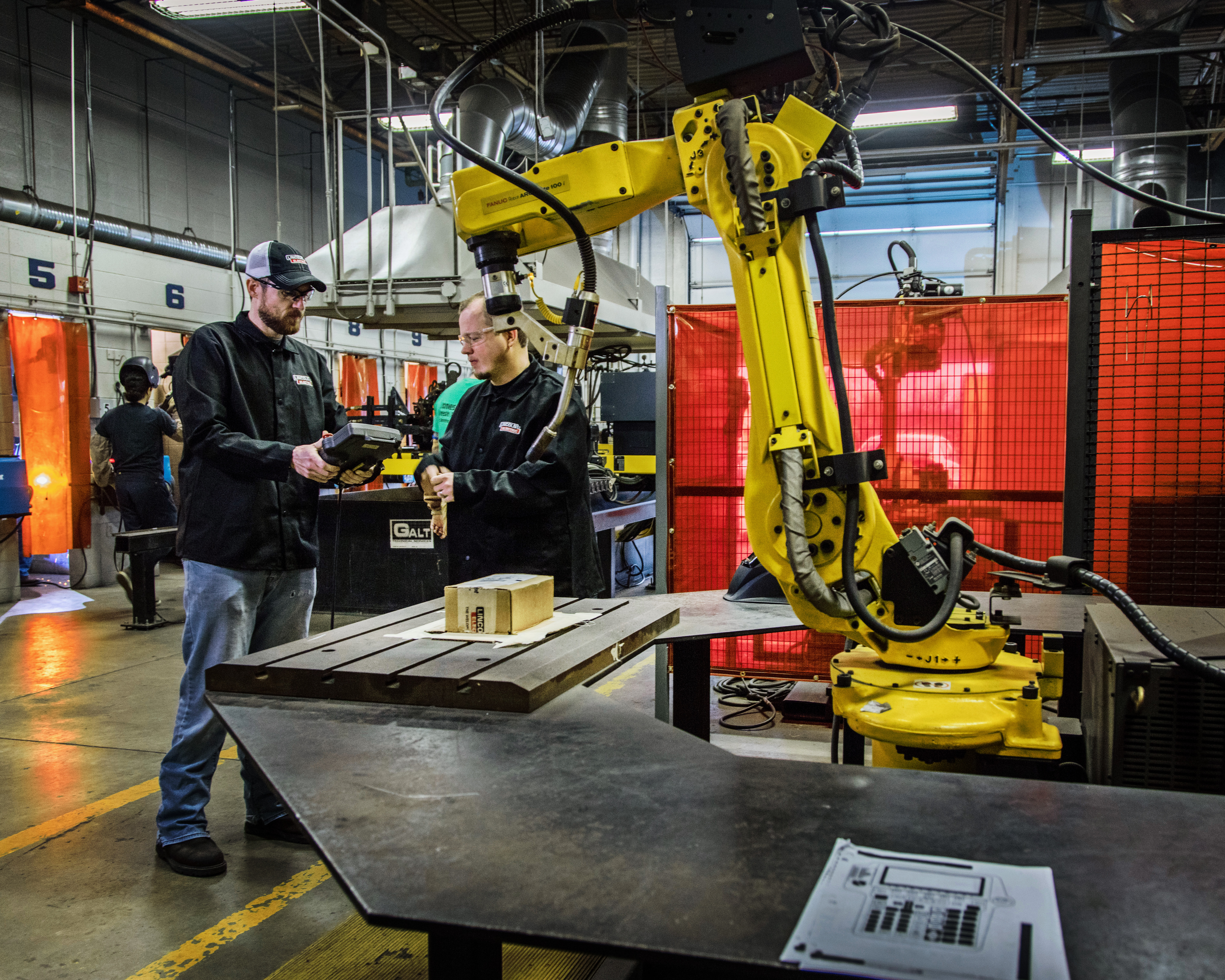 Two people in factory setting